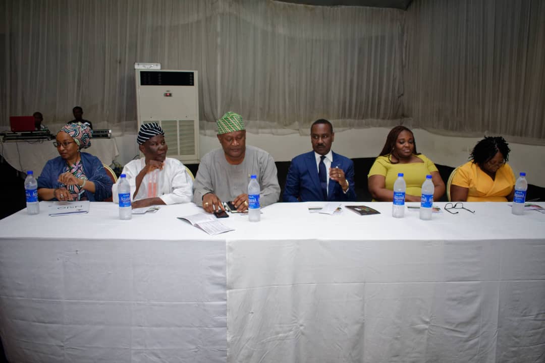 Image of Board of trustees setting on the high table
